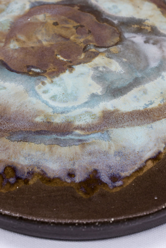 Large 23 cm Tidepool Smoked Grey ceramic dinner plate by Ribera Handmade Ceramics featuring a textured stoneware finish.