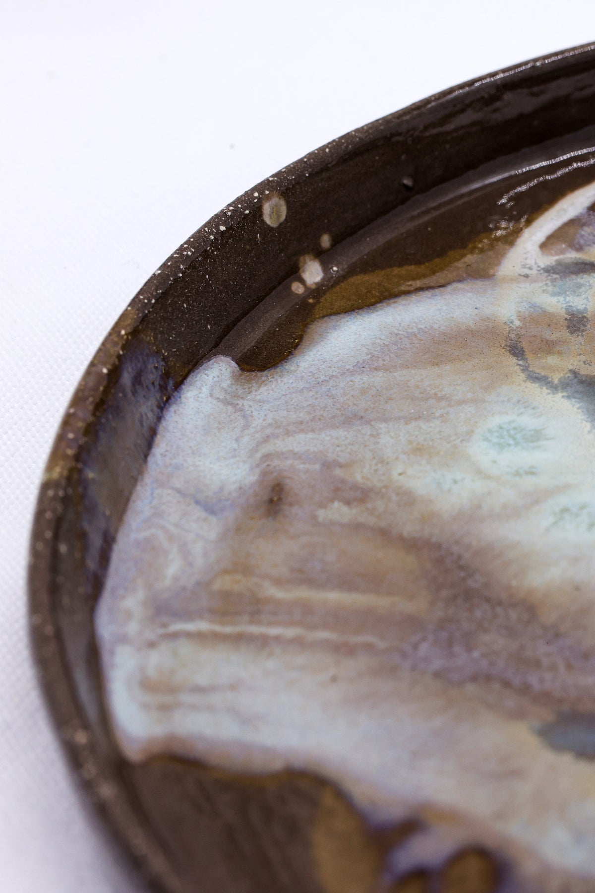 Large 23 cm Tidepool Smoked Grey ceramic dinner plate by Ribera Handmade Ceramics, showcasing its handmade stoneware design.