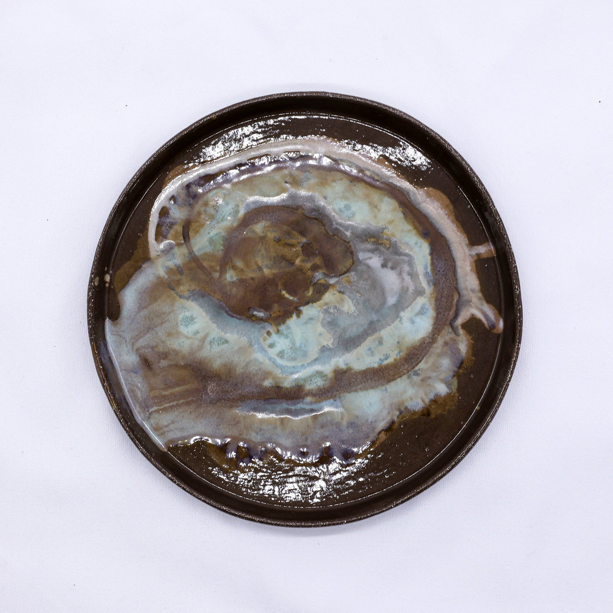 Large 23 cm Tidepool smoked grey ceramic dinner plate by Ribera Handmade Ceramics, showcasing its handcrafted stoneware design.
