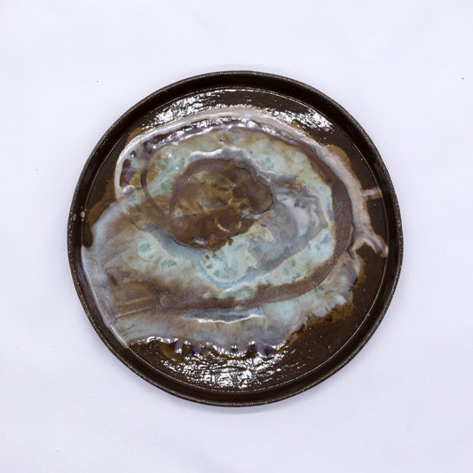 Large 23 cm Tidepool smoked grey ceramic dinner plate by Ribera Handmade Ceramics, showcasing its handcrafted stoneware design.