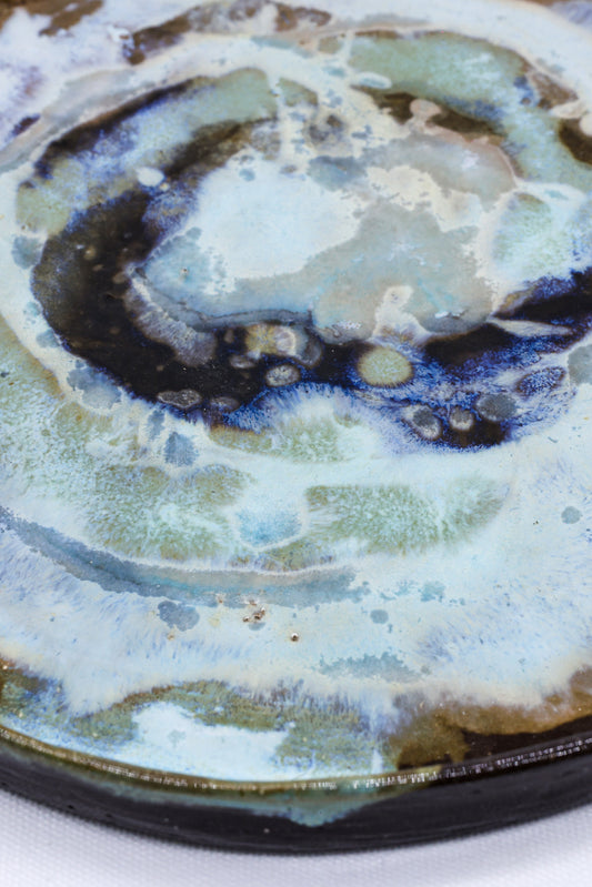 Large 23 cm Coralight smoked grey stoneware dinner plate by Ribera Handmade Ceramics, showcasing its textured ceramic surface.