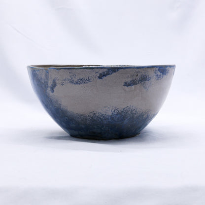Large blue handmade ceramic dinner bowl with stone reef design from Ribera Handmade Ceramics, showcasing its textured stoneware surface.