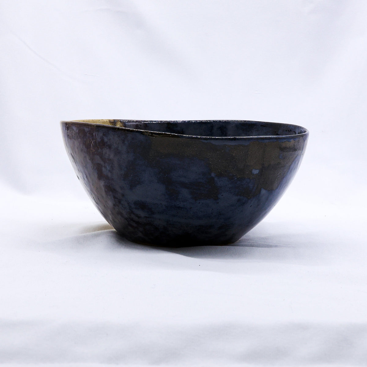 Large Indigo Clay Shore ceramic dinner bowl by Ribera Handmade Ceramics, featuring a handcrafted stoneware design.