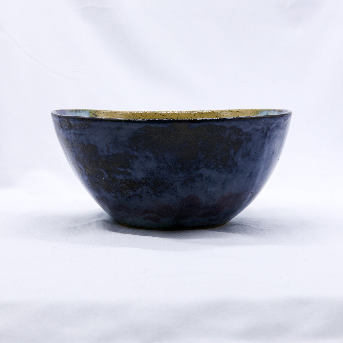 Large Ochre Tide Speckle handmade ceramic stoneware dinner bowl by Ribera Handmade Ceramics, showcasing a speckled ochre and tide design.