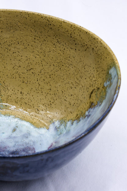 Large ochre tide speckle handmade ceramic stoneware dinner bowl by Ribera Handmade Ceramics, with a textured speckled glaze finish.