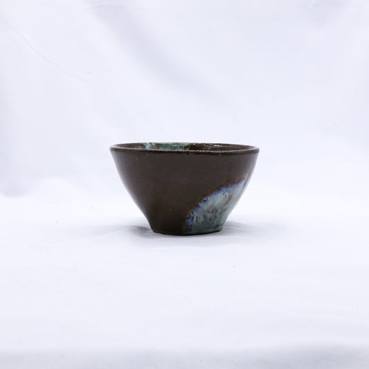 Blue handmade ceramic dinner bowl featuring a small stone reef design by Ribera Handmade Ceramics.