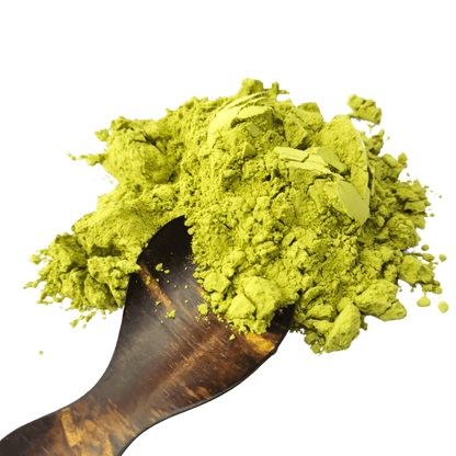 Porter Hill Tea Company Izu Matcha green tea powder in a bowl with a bamboo whisk, ready for preparation.