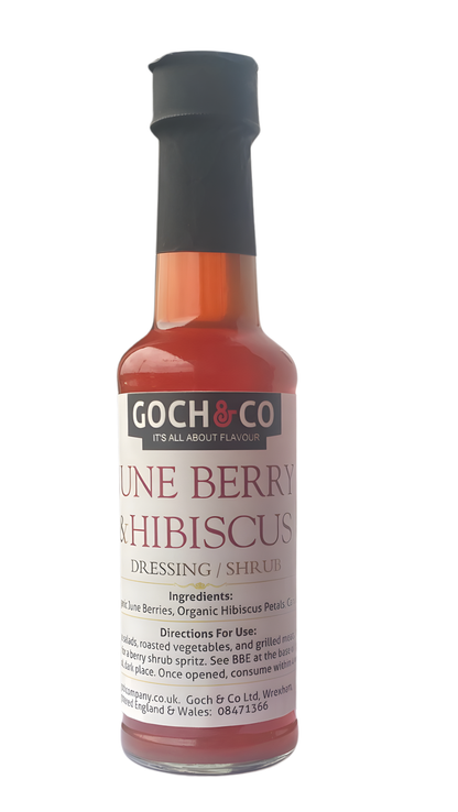June Berry and Hibiscus Goch & Co dressing bottle with vibrant label, showcasing the floral and berry ingredients.