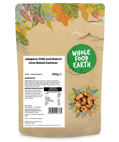 Baked cashews with jalapeno chili and makrut lime flavor from Whole Food Earth, displayed in a bowl with some cashews scattered around.