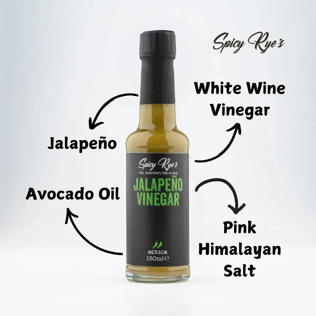 Bottle of Spicy Ryes Jalapeño Vinegar with fresh jalapeños and herbs inside, ready to add flavor to dishes.