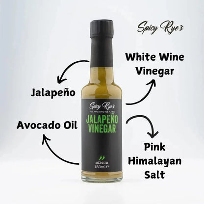 Bottle of Spicy Ryes Jalapeño Vinegar with fresh jalapeños and herbs inside, ready to add flavor to dishes.