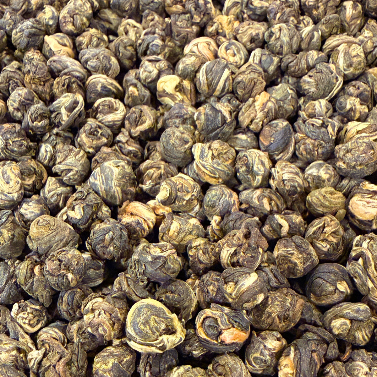 Loose green tea pearls from Porter Hill Tea Company, Jasmine Dragon Pearls with fresh jasmine aroma and vibrant green leaves.