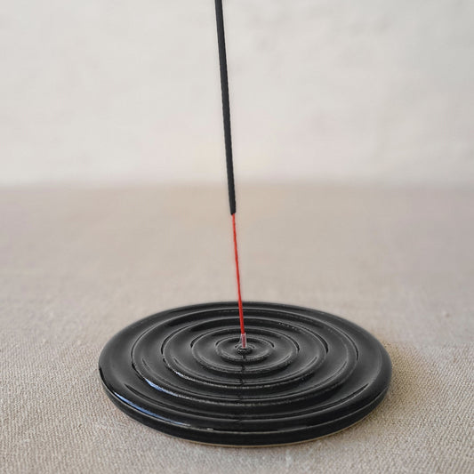 Jet black classic incense burner by Katie L Thompson Designs, featuring a sleek, round design with a wide opening for incense sticks.