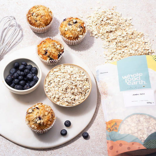 Whole Food Earth Jumbo Oats in a bowl with milk and fruit, showcasing a healthy cereal breakfast option.