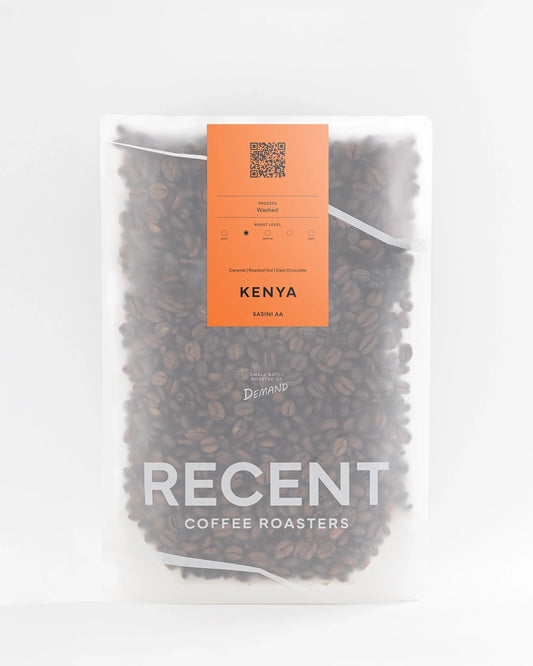 Recent Beans Sasini AA Medium Roast Coffee bag with Kenya origin label, showcasing premium coffee beans in a burlap sack.