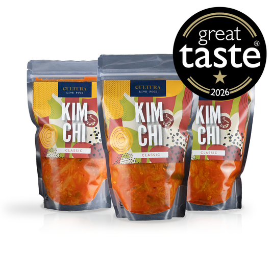 Cultura Live Food Kimchi Bundle 3 Pack featuring assorted jars of traditional fermented Korean kimchi on a plain background.