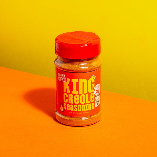 A shaker jar of King Creole Seasoning by The GOAT Seasoning Blends, containing 180g of flavorful American spice blend.