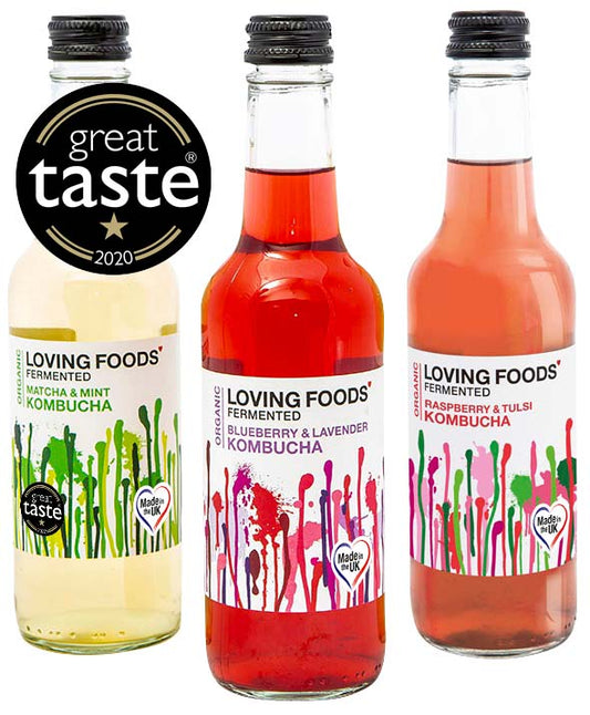 Assorted organic kombucha bottles from Loving Foods, featuring different flavors in a mixed case selection.