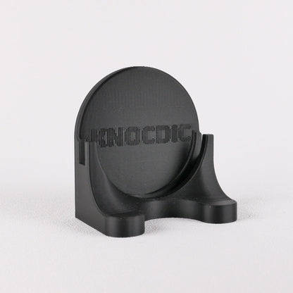 KNOCDIC® magnetic universal portafilter holder for 51mm, 54mm, and 58mm portafilters, shown holding a coffee portafilter.