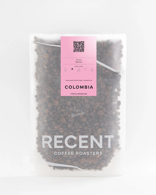 Colombia Finca Maracay Medium Roast Coffee bag from Recent Beans, with vibrant pink packaging and detailed product label.
