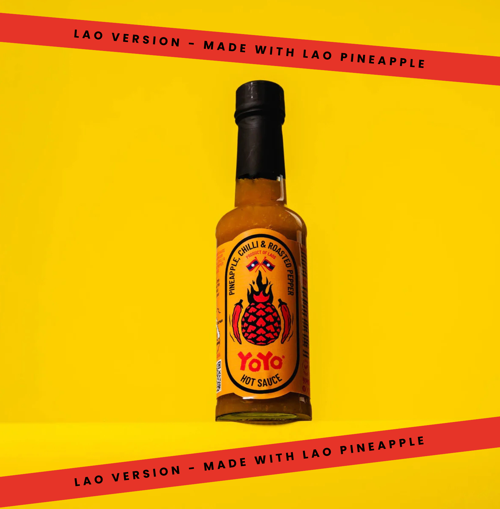 Signature Lao Pineapple Hot Sauce by YoYo Laos Sauce, featuring a vibrant pineapple-flavored hot sauce in a clear bottle.
