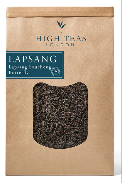Loose leaf Lapsang Souchong Butterfly tea by High Teas, showing dark, smoky tea leaves in a natural, rustic presentation.