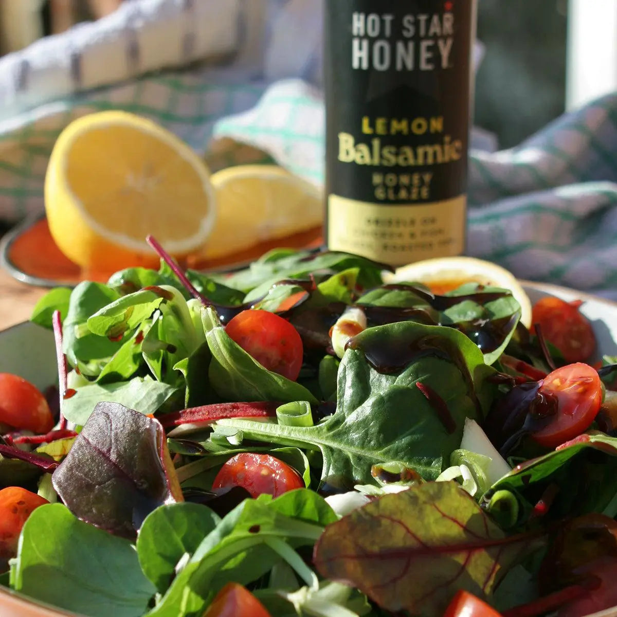 Lemon balsamic honey glaze in a jar from Hot Star Honey, showcasing a golden-brown glossy balsamic glaze with lemon flavor.