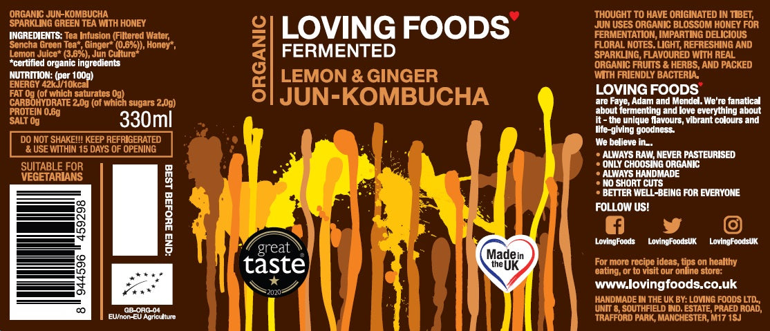 Bottle of Loving Foods Organic Jun-Kombucha with lemon and ginger flavor, featuring fresh lemon slices and ginger root on the label.