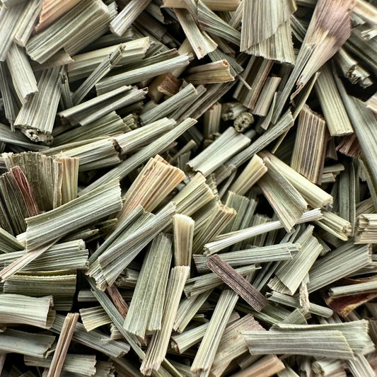 Loose leaf lemongrass herbal tea from Porter Hill Tea Company, showing fresh yellow-green lemongrass stalks and leaves.
