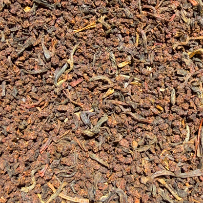 Loose leaf English Breakfast black tea from Porter Hill Tea Company, showing a close-up of dark, rich tea leaves.