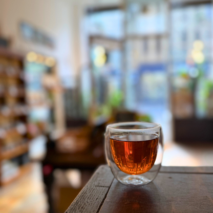 Loose leaf Jasmine Masala Chai black tea by Porter Hill Tea Company, showcasing fragrant tea leaves with spices and jasmine petals.