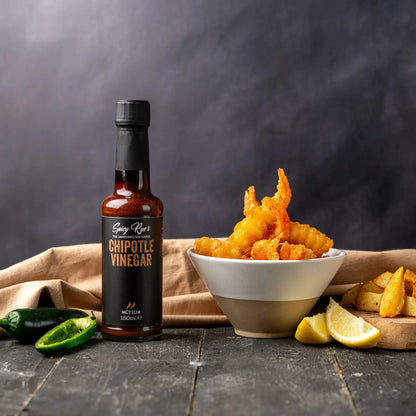 Spicy Ryes Chipotle Vinegar bottle with dark label and spout, close-up shot showing the spicy chili flavor and branding.