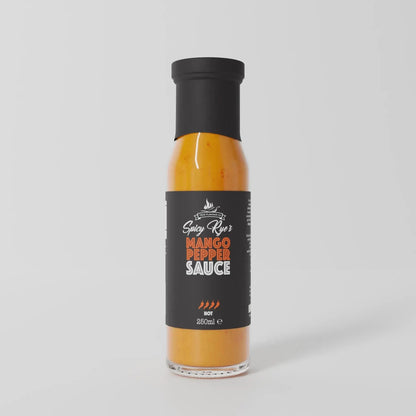 Spicy Ryes Mango Pepper Hot Sauce bottle with vibrant label, showcasing fresh mango and chili peppers on a wooden surface.