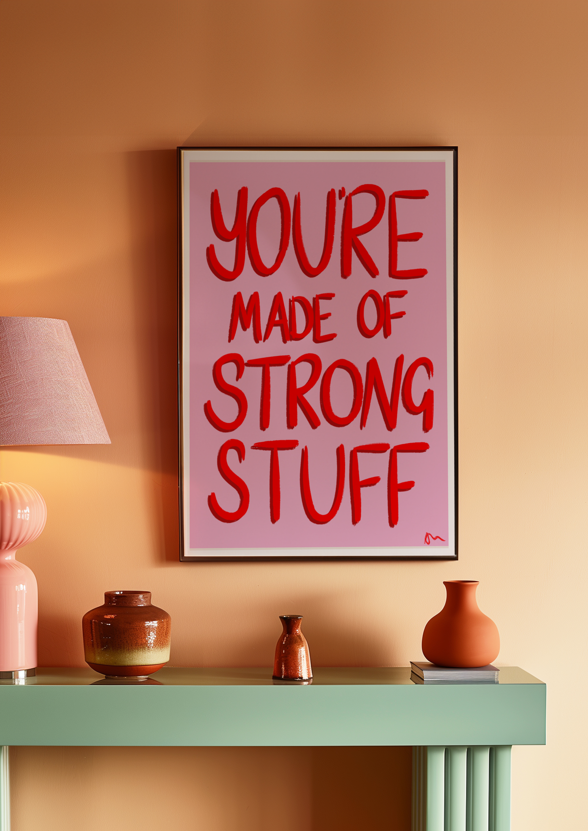 Pink and red inspirational art print titled "You’re Made of Strong Stuff" by Peak Prints, featuring bold, uplifting message on a white background.