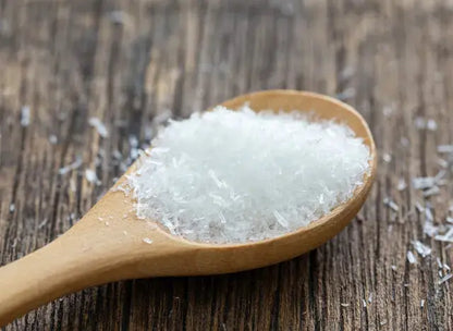 Whole Food Earth MSG fine monosodium glutamate in a clear container, showing the white crystalline powder inside.