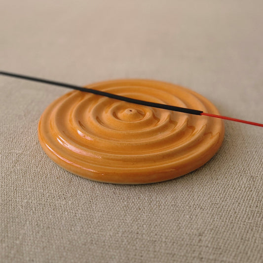 Mandarin orange ceramic incense burner by Katie L Thompson Designs with a traditional design perfect for home decor.