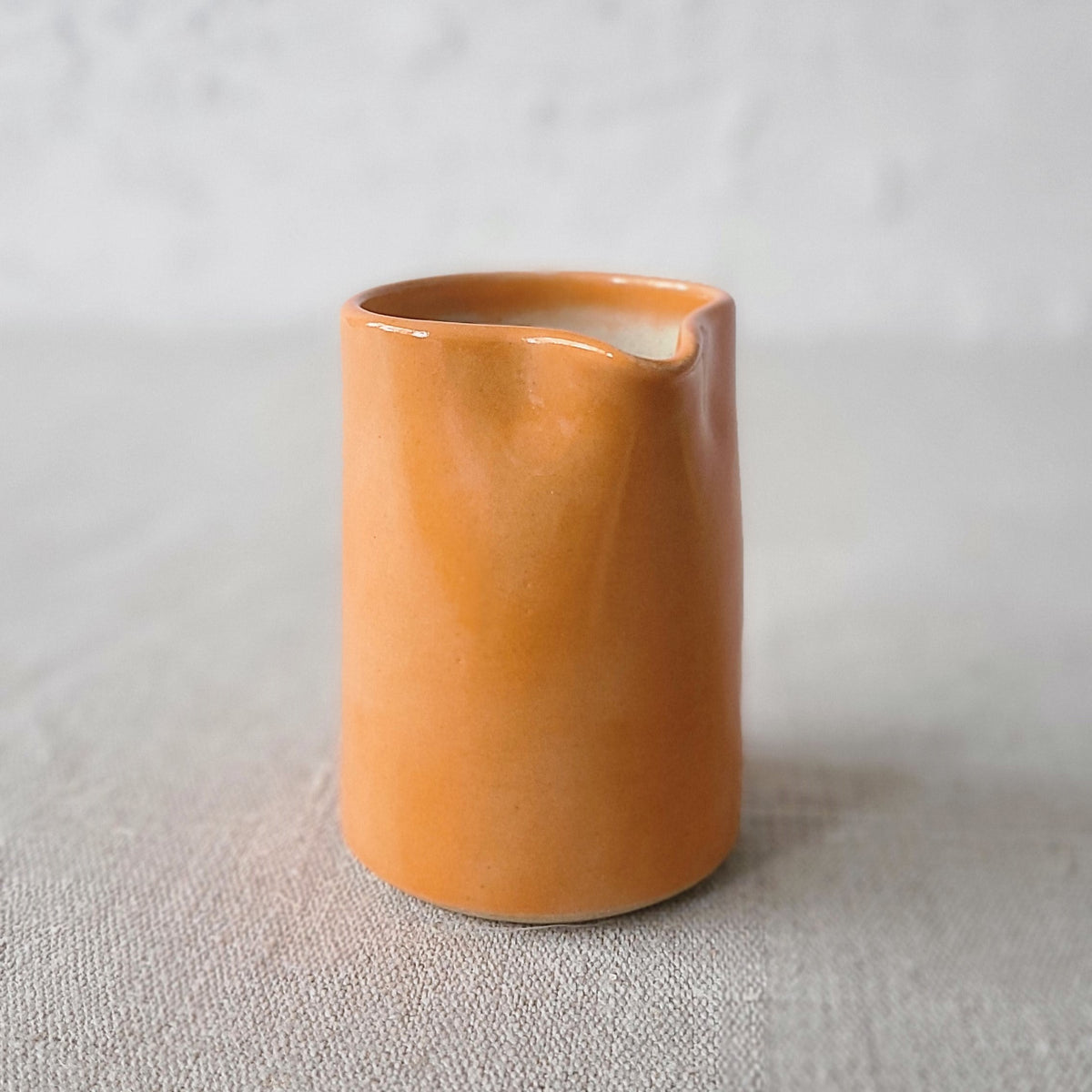 Small ceramic jug with mandarin orange design by Katie L Thompson Designs, featuring a classic, charming style.