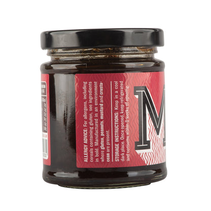 Jar of Manfood Smokey Onion Relish showing dark, flavorful relish with visible onion pieces in a glass jar.