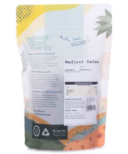 Whole Food Earth Medjoul Dates, dried fruit, large, glossy, dark brown Medjool dates on a white background.