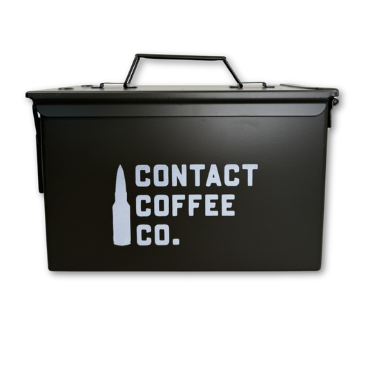 Metal coffee ammo box gear by Contact Coffee Company Ltd., compact metal tin with military-style design for storing coffee accessories.