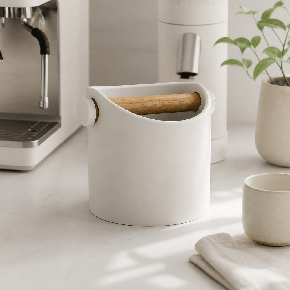 Minimalist coffee knock box by KNOCDIC® with a sleek design and real oak wood bar for espresso machine tamping cleanup.