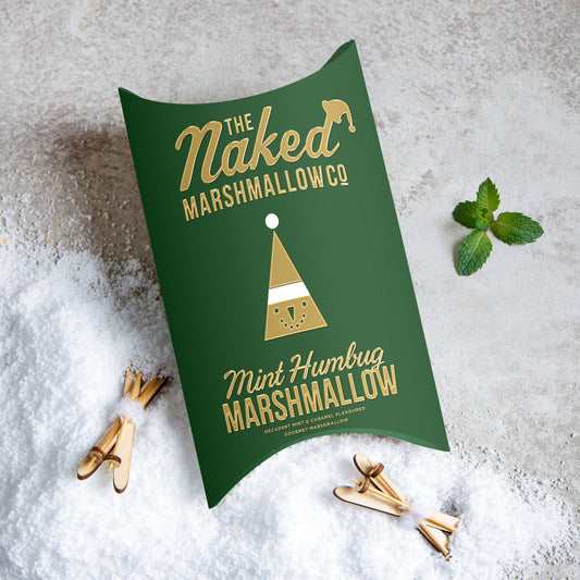 Assorted mint humbug gourmet marshmallows by THE MARSHMALLOW FACTORY, with striped green and white peppermint flavor, on a white background.