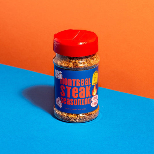 Montreal Steak Seasoning by The GOAT Seasoning Blends in a 250g shaker, featuring a colorful blend of herbs and spices for grilling.
