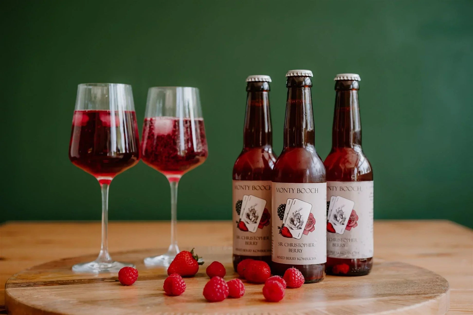 Monty Booch Sir Christopher Berry Raw, unfiltered mixed berry kombucha in a 330ml bottle, 12-pack with vibrant berry visuals.