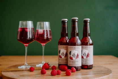 Monty Booch Sir Christopher Berry Raw, unfiltered mixed berry kombucha in a 330ml bottle, 12-pack with vibrant berry visuals.