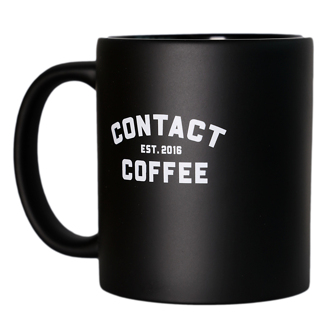 Contact Coffee Co mug featuring the Charlie gear logo, a stylish ceramic coffee cup with a modern design and printed branding.