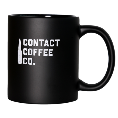 Contact Coffee Co Mug Alpha, a ceramic gear-shaped coffee mug with the Contact Coffee Company Ltd. logo and design visible.