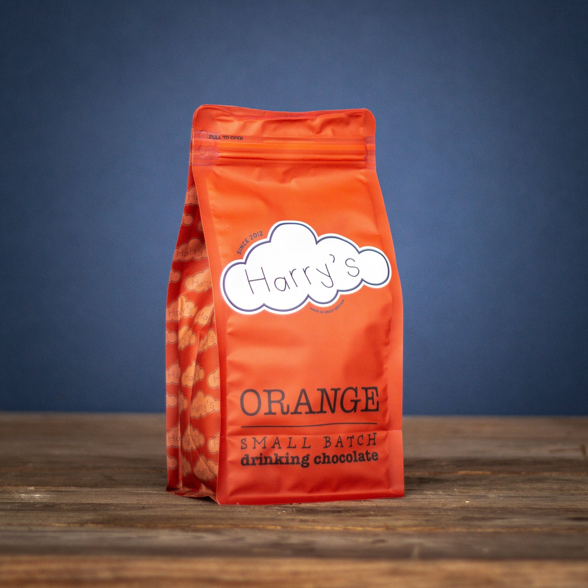 Bag of Harry's Hot Chocolate orange-flavored hot chocolate powder in a 1kg bag with orange packaging.