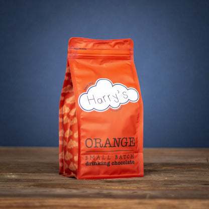 Bag of Harry's Hot Chocolate orange-flavored hot chocolate powder in a 1kg bag with orange packaging.