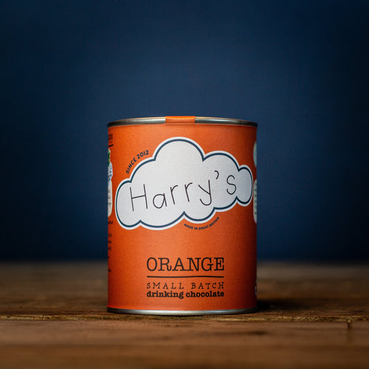 Square of Harry's Hot Chocolate orange-flavored hot chocolate with 44% cocoa content, shown in a vibrant orange color.